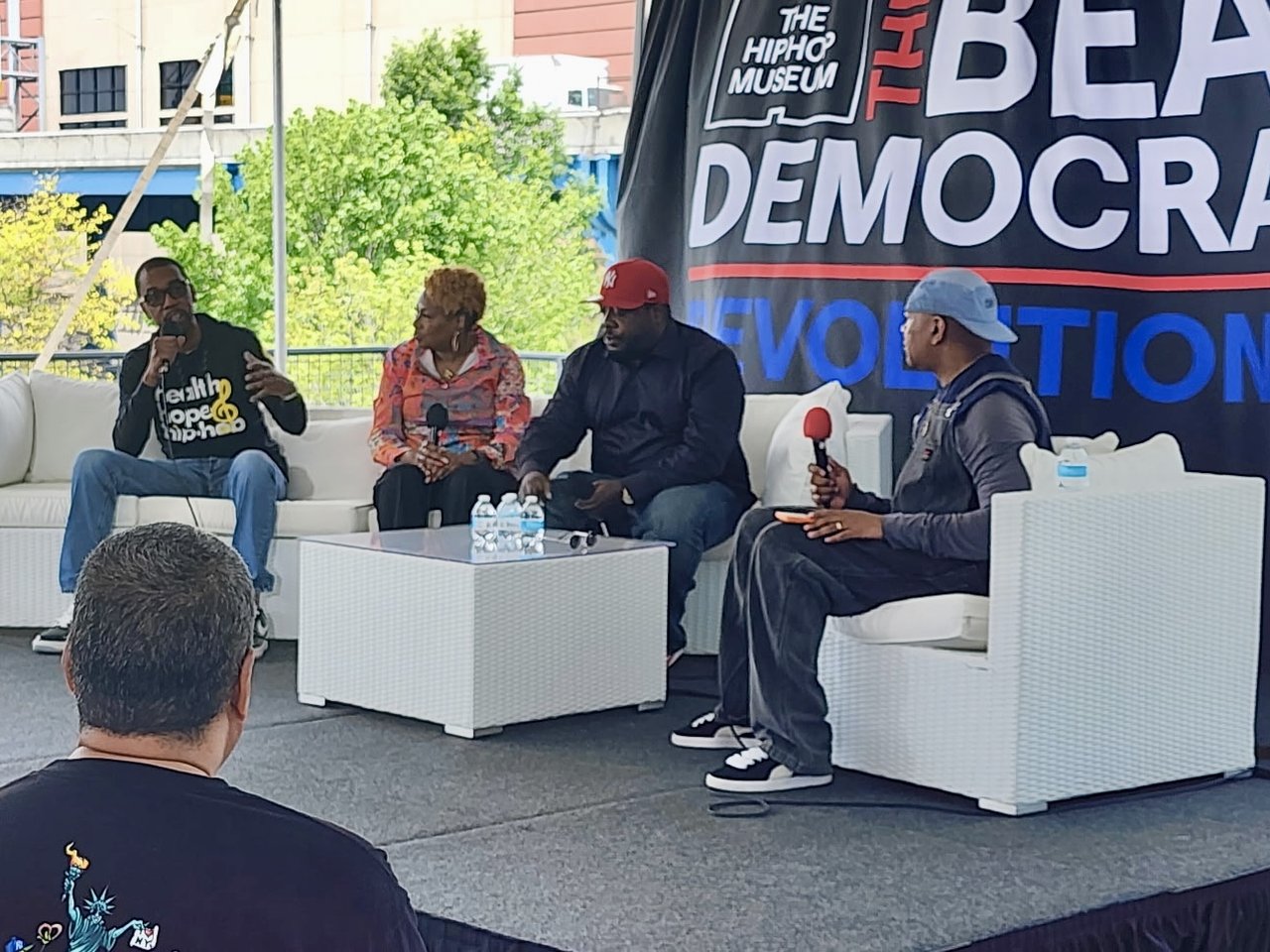 Panel discussion at International Hip Hop Health Day: Oya Gilbert, Maria Davis, MC Stik-E and Kevin Powell seated on stage at The Hip Hop Museum.
